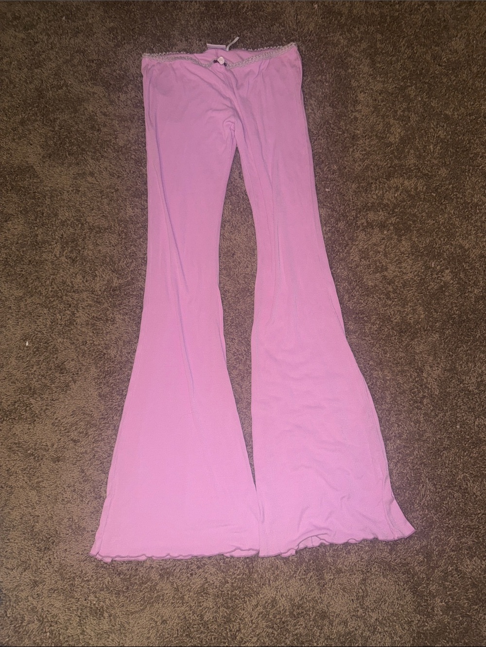 Out from under pink ribbed lounge pants